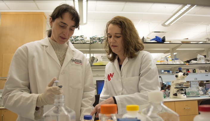 Tammy Kielian (right), PhD, professor in the department of pathology and microbiology in the UNMC College of Medicine