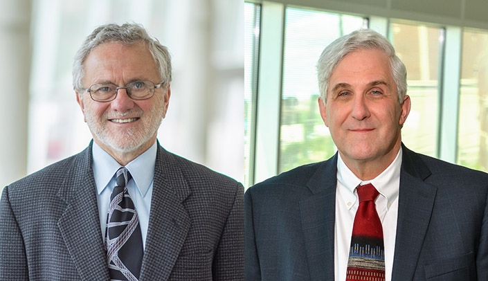 From left, Samuel Cohen, MD, PhD, and Jon Thompson, MD, both were honored for 40 years of service at the UNMC Annual Faculty Meeting.
