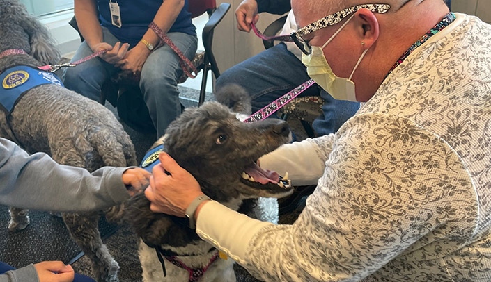 Josie and MMI's Emily Ziskovsky share a laugh during the recent visit by Love on a Leash.
