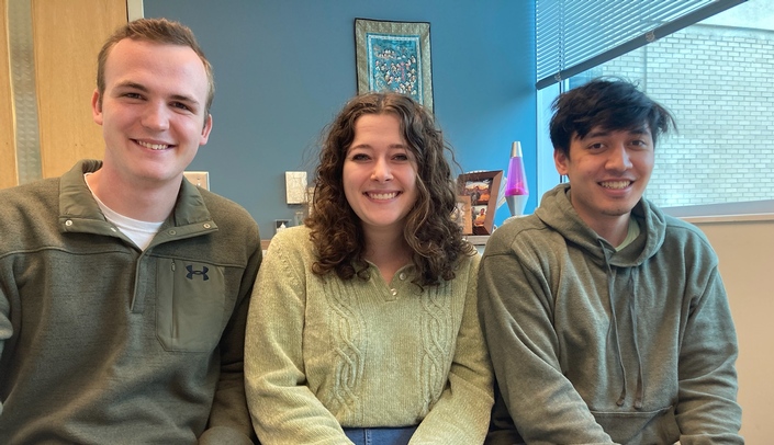 INBRE scholar and biology major, Nathan Zimmerman, at left, joins biomedical science graduate student, Carolyn Baker and  biology major, Aaron Marta, in Dr. Annemarie Shibata's lab.