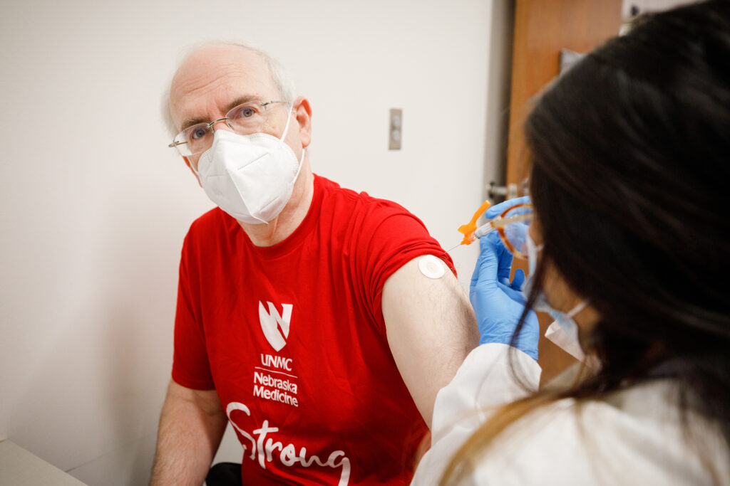 Med center strong Dr. Gold rolls up sleeve for flu shot Newsroom