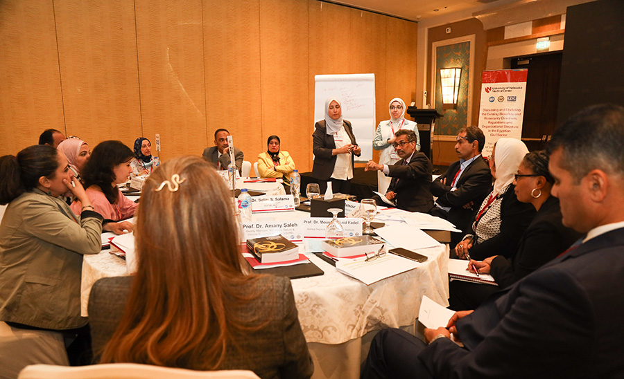 Members of the UNMC College of Public Health &lpar;COPH&rpar; conduct workshops in Egypt in August of 2022&period; COPH Dean&comma; Ali Khan&comma; MD&comma; MPH&comma; is seen seated in the center of the photo with his arm extended&period;