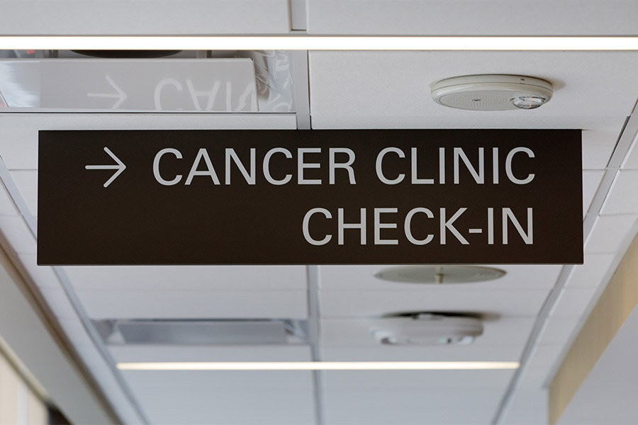A sign designates the patient registration area at the Buffett Cancer Center.