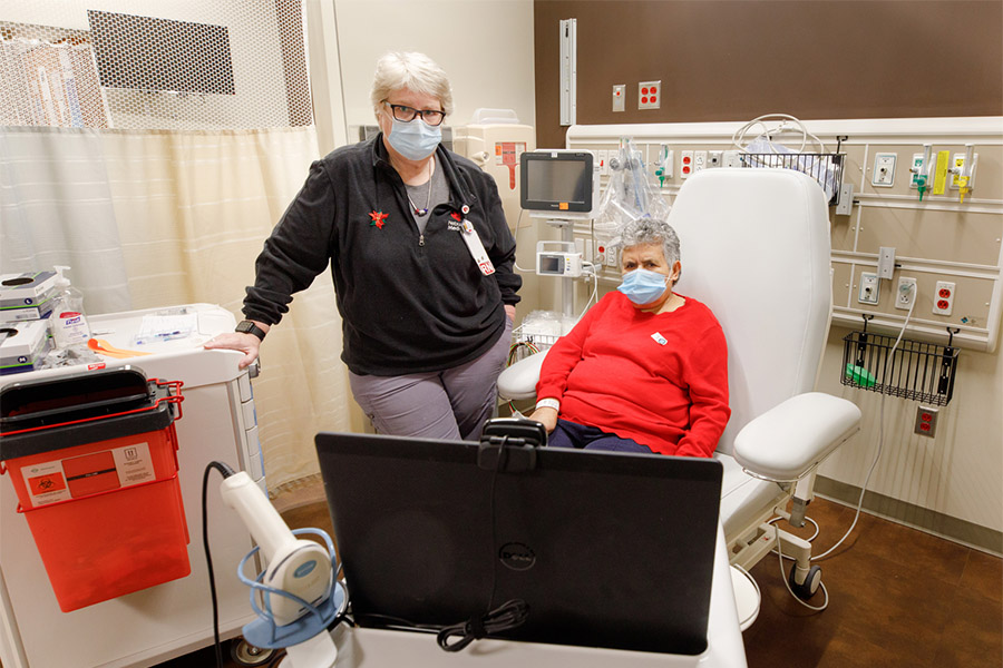 Maria Alvarran participates in a video call with a medical interpreter at the Buffett Cancer Center.