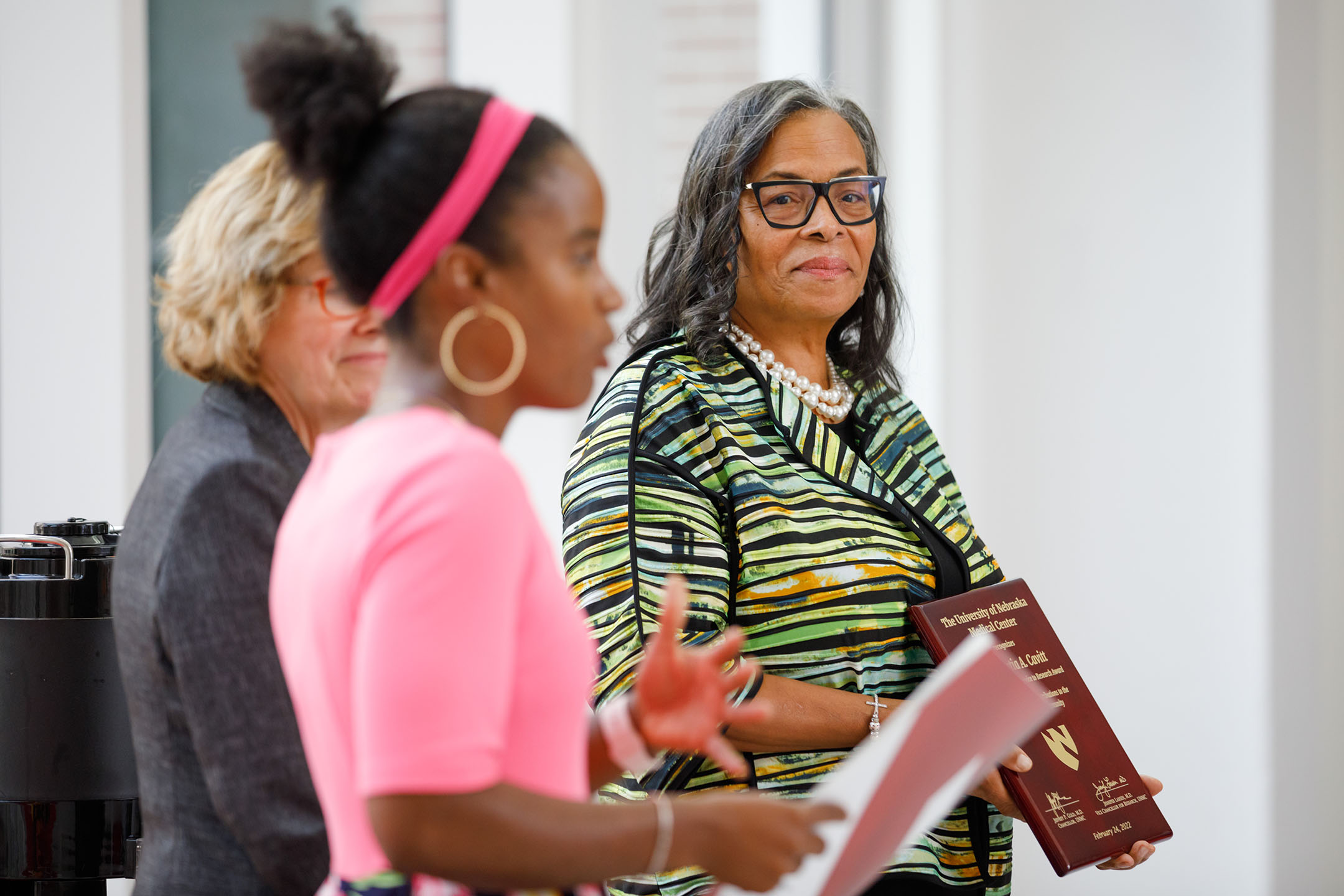 UNMC&apos;s Jasmine Marcelin&comma; MD&comma; addresses the Rev&period; Portia Cavitt&comma; right&comma; at the 2021 Community Service to Research Awards Ceremony on Sept&period; 19&period;