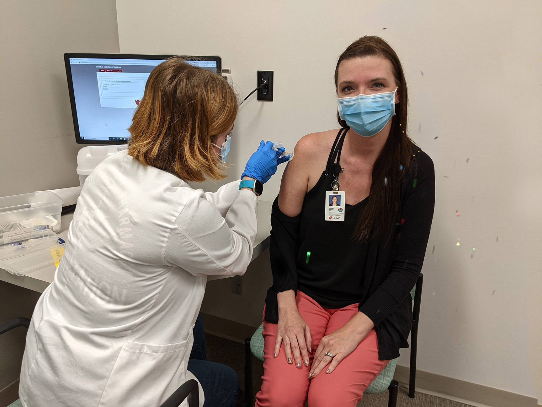 Confetti flew as Operation Immunization delivered its 15&comma;000th flu vaccine since the UNMC College of Pharmacy project began in 2017&period; Madalynne Stubbendick&comma; P3&comma; administered the shot to Amber Hawk&comma; pharmacy&apos;s admissions and recruitment director&period;