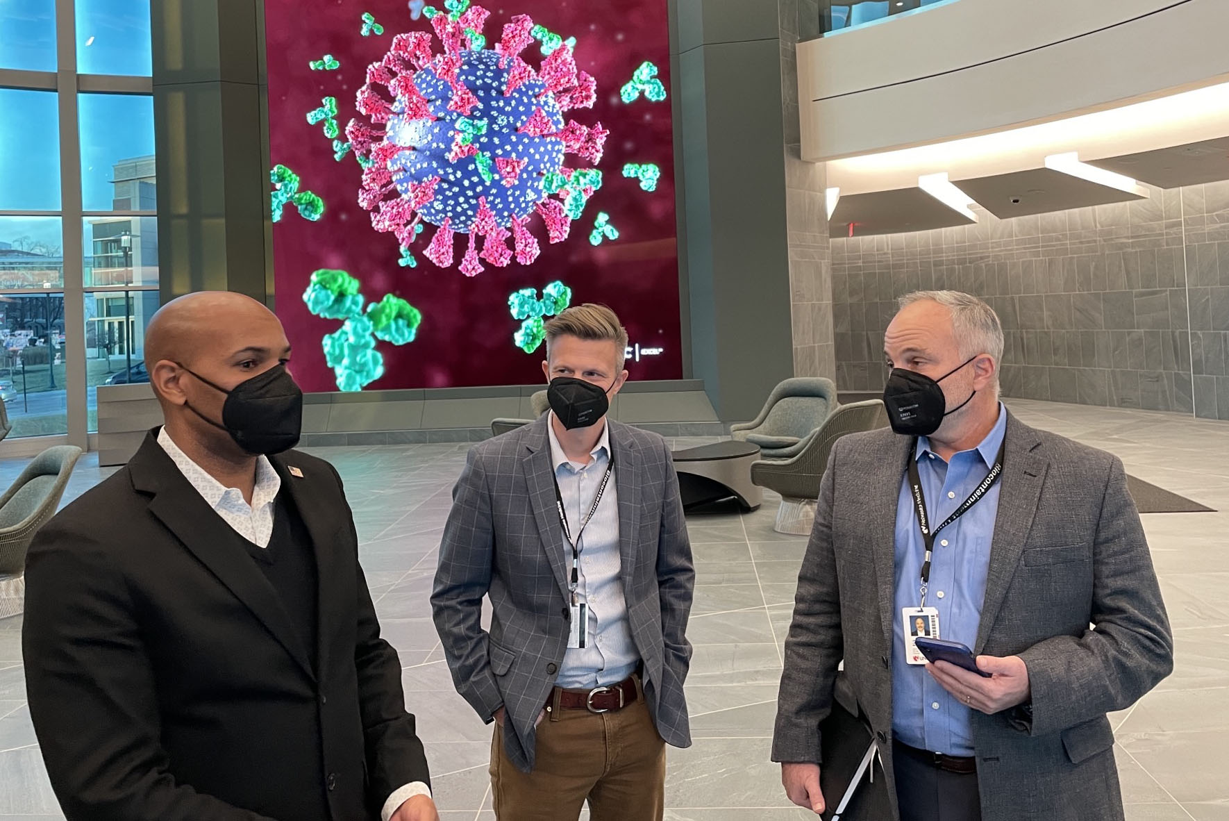 Former U&period;S&period; surgeon general Jerome Adams &lpar;left&rpar;&comma; MD&comma; tours the Davis Center for Global Security with John Lowe&comma; PhD&comma; and James Lawler&comma; MD&comma; of the UNMC Global Center for Health Security&period;