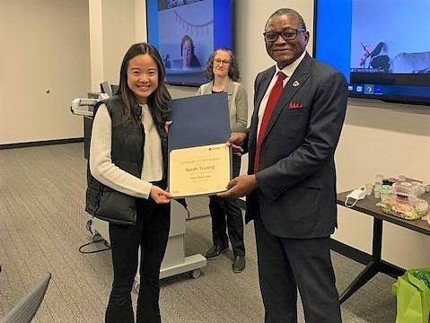 Sarah Truong is congratulated by Karen Gould&comma; PhD&comma; and Dele Davies&comma; MD&comma; upon completion of the thesis boot camp&period;