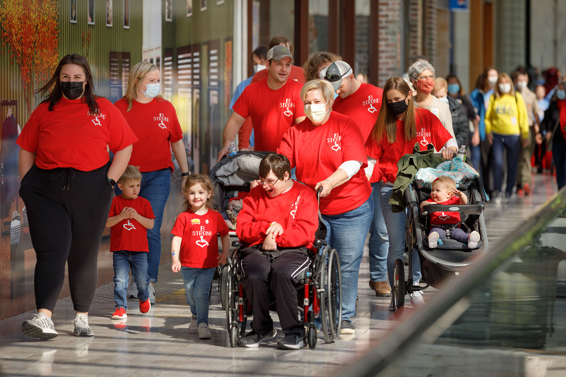 Participants take a lap around Oakview Mall during the 2022 Walk and Roll for Disabilities&period;