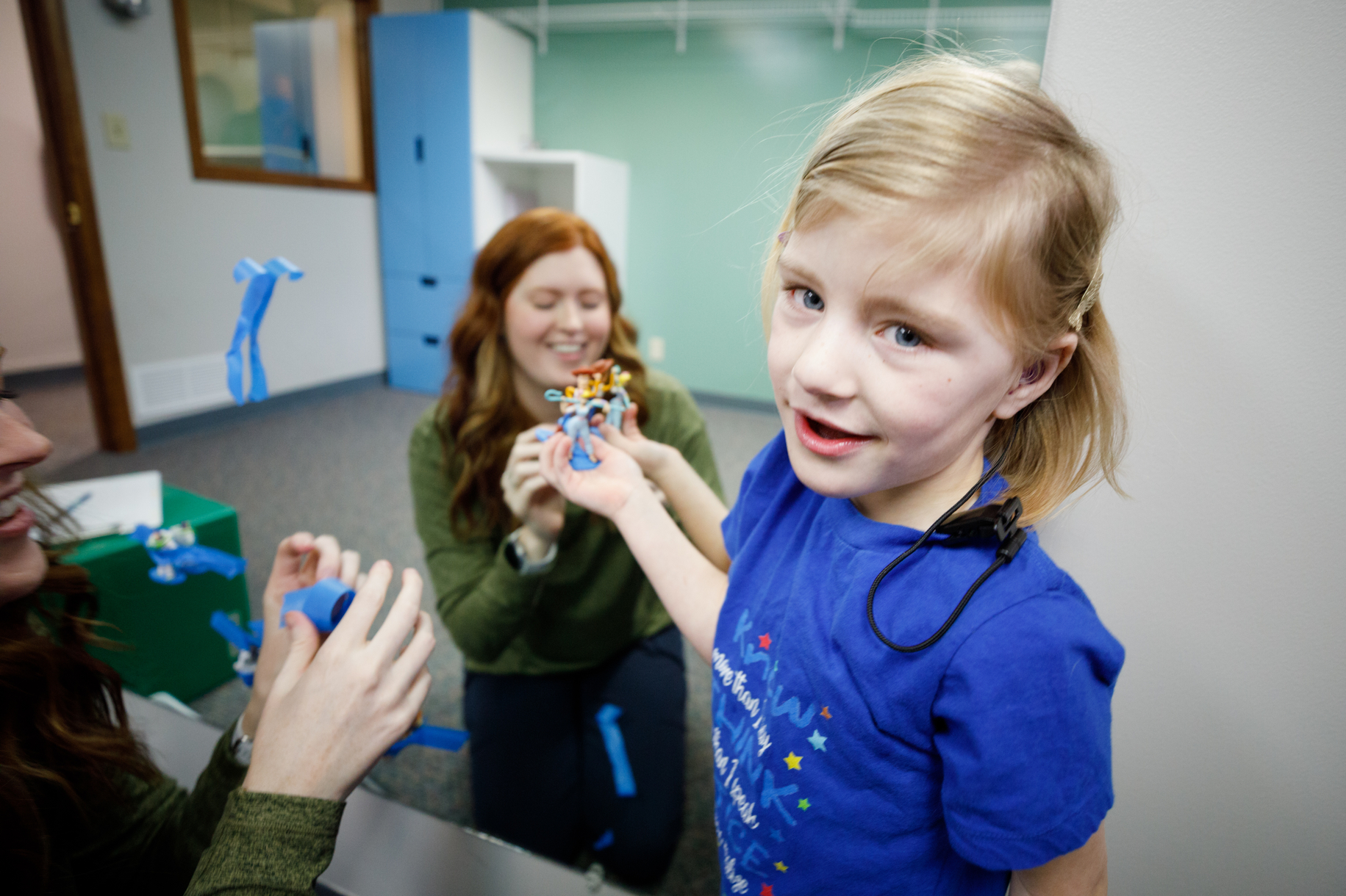 Young Hannah plays a game during speech therapy.