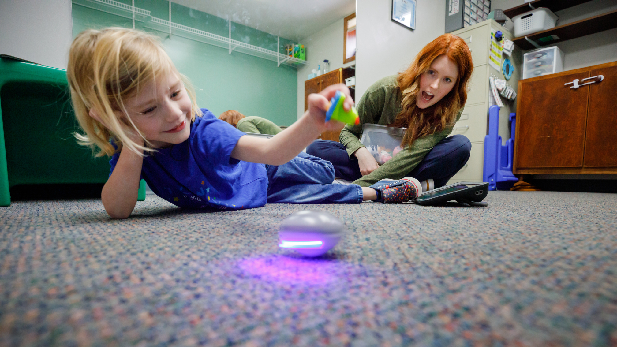 Hannah plays with a spinning toy