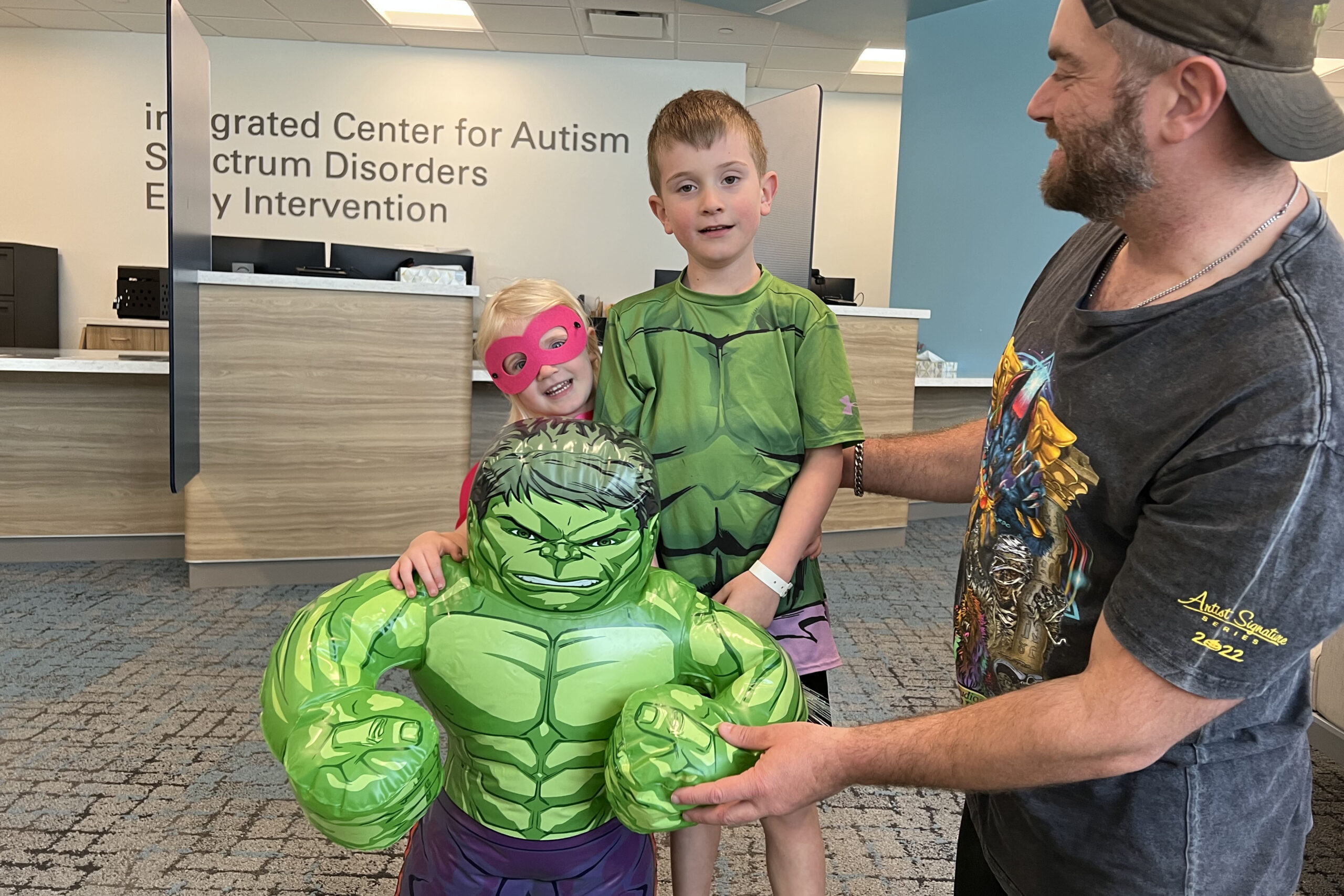 Twila and Clint Monico&comma; with father Nathan&comma; marked Superhero Day at the Munroe-Meyer Institute&period;