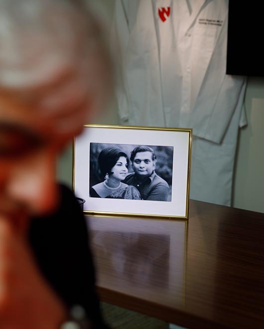 A portrait of his parents on the desk of Sunil Hingorani, MD, PhD.