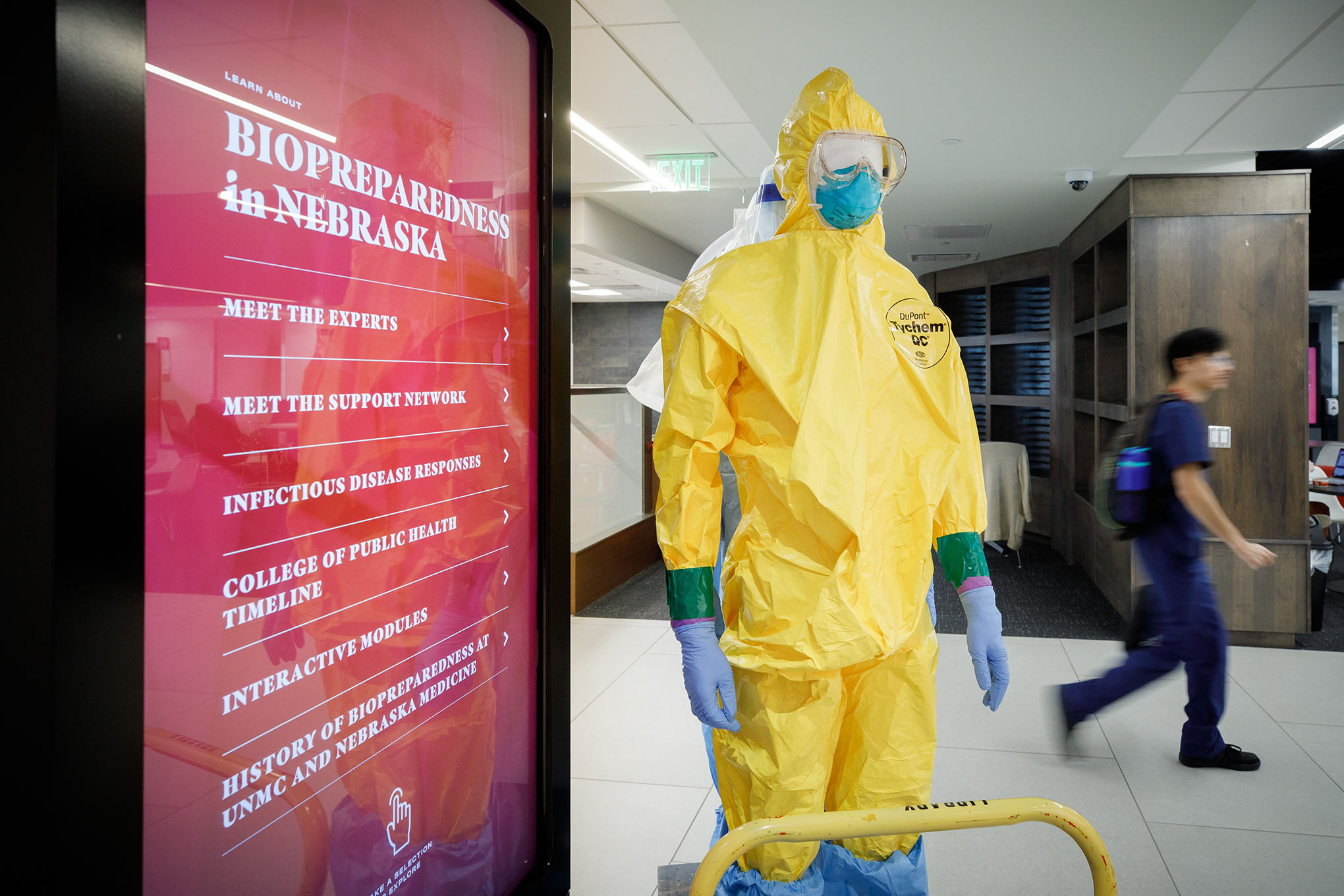 Mannequins wearing personal protective equipment line up to go on display in the "Biopreparedness in Nebraska" exhibit at the Wigton Heritage Center&comma; in front of an interactive digital board&period;