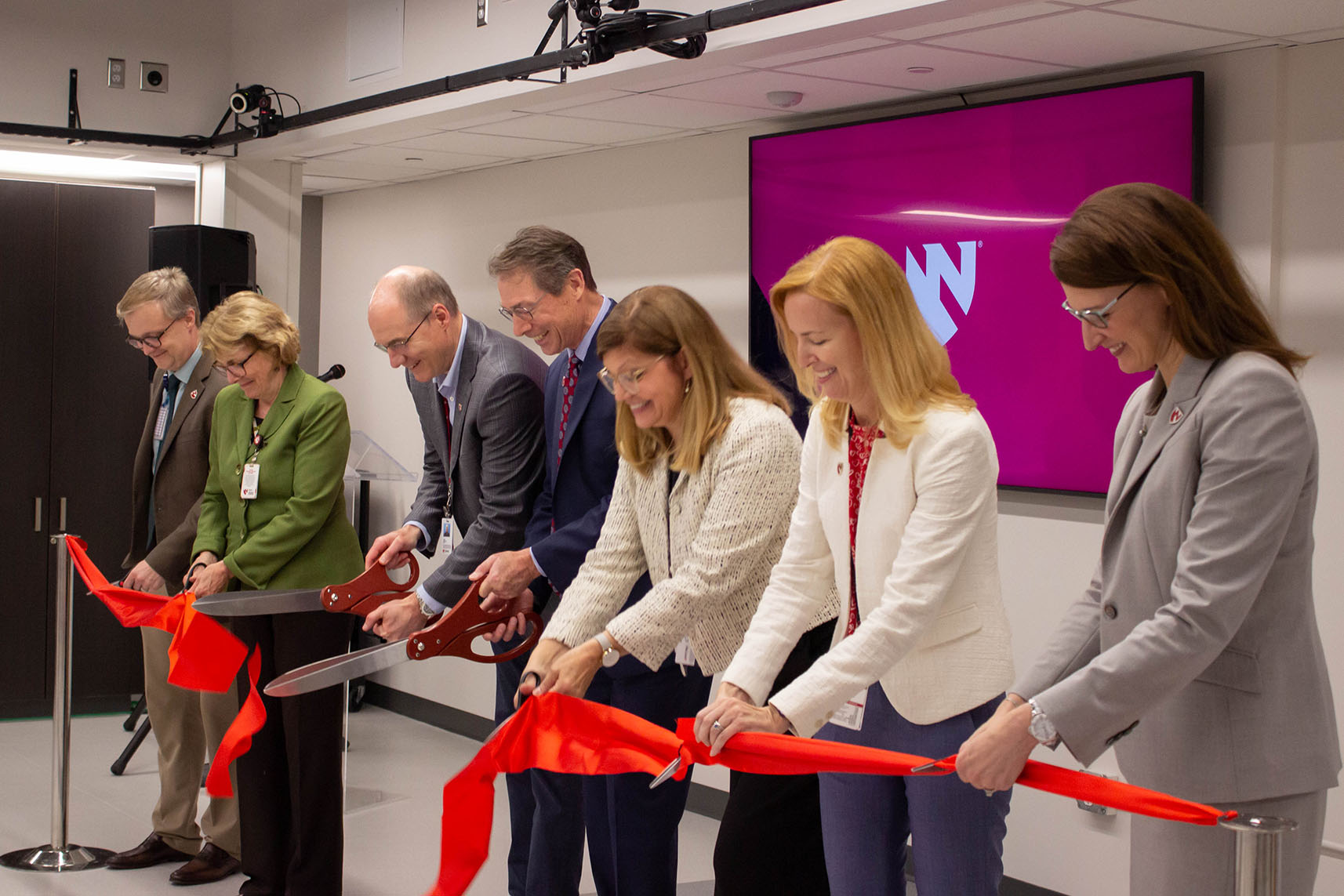 A ribbon cutting heralded the official opening of a newly renovated health and wellness clinical research lab open to collaborators across UNMC colleges and institutes&period; From left&colon; Russell McCulloh&comma; MD&comma; Jennifer Larsen&comma; MD&comma; Kenneth Bayles&comma; PhD&comma; Kyle Meyer&comma; PhD&comma; Laura Bilek&comma; PhD&comma; Yvonne Golightly&comma; PhD&comma; and Betsy Becker&comma; DPT&comma; PhD