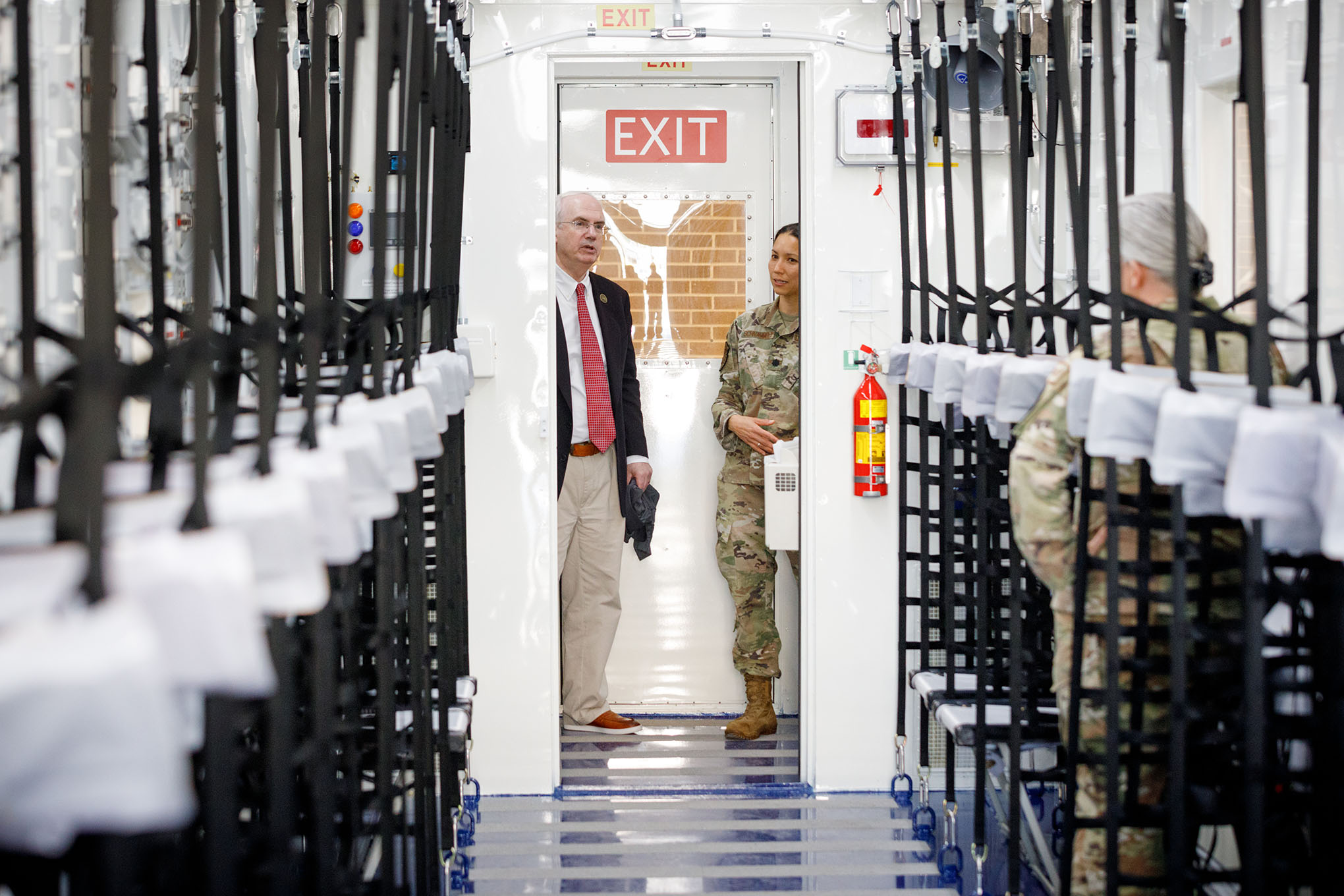 UNMC Chancellor Jeffrey P&period; Gold&comma; MD&comma; left&comma; tours the new Negatively Pressurized Conex unit with Lt&period; Col&period; Elizabeth Schnaubelt&comma; MD&period;