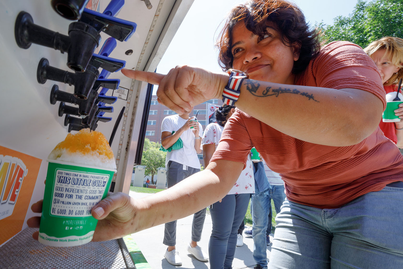 Debalina Mukhopadhyay&comma; PhD&comma; adds flavor to her shaved ice at the "Summer Chill" event sponsored by UNeMed and the UNMC Office of the Vice Chancellor for Research&period;