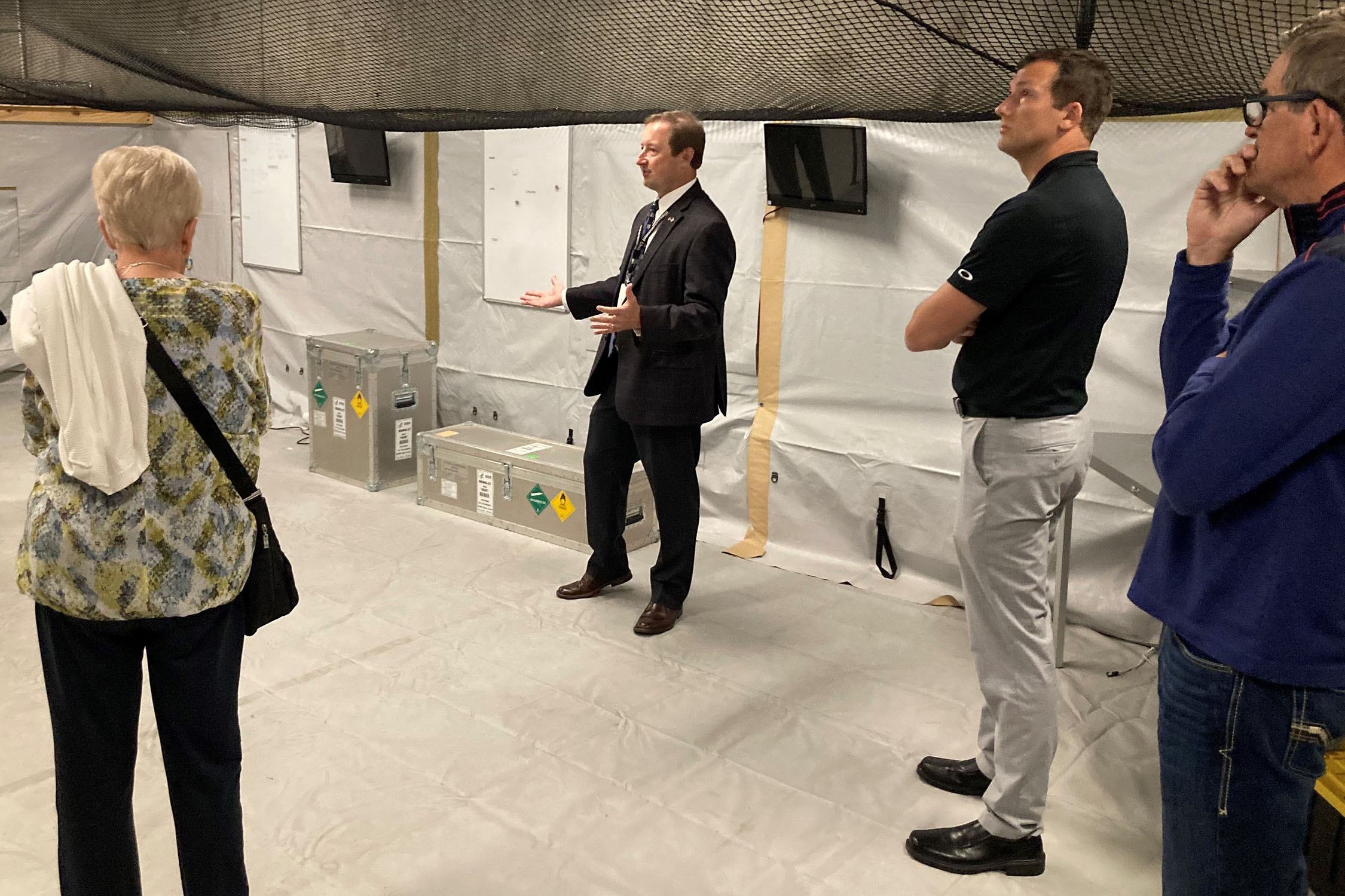 Chris Kratochvil&comma; senior advisor to UNMC’s Global Center for Health Security and interim vice chancellor of external relations&comma; shows economists with the National Business Economic Issues Council an austere training environment housed within the Davis Global Center&period;