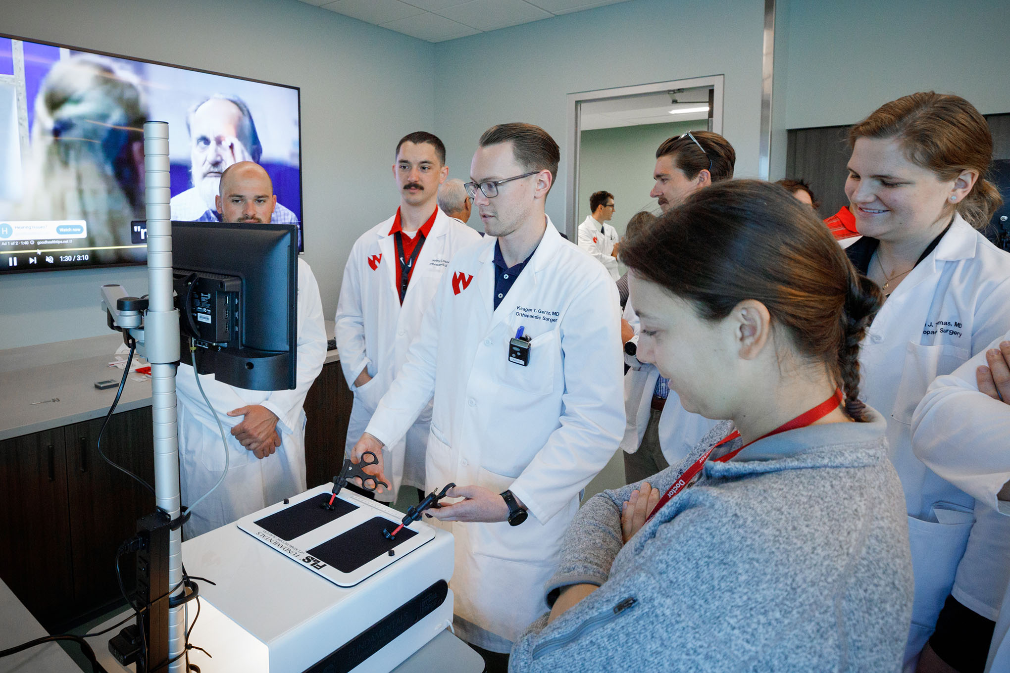 The UNMC Department of Orthopaedic Surgery and Rehabilitation and representatives from the American Board of Orthopaedic Surgery tour iEXCEL’s surgery simulation and virtual reality areas in the Davis Global Center&period;