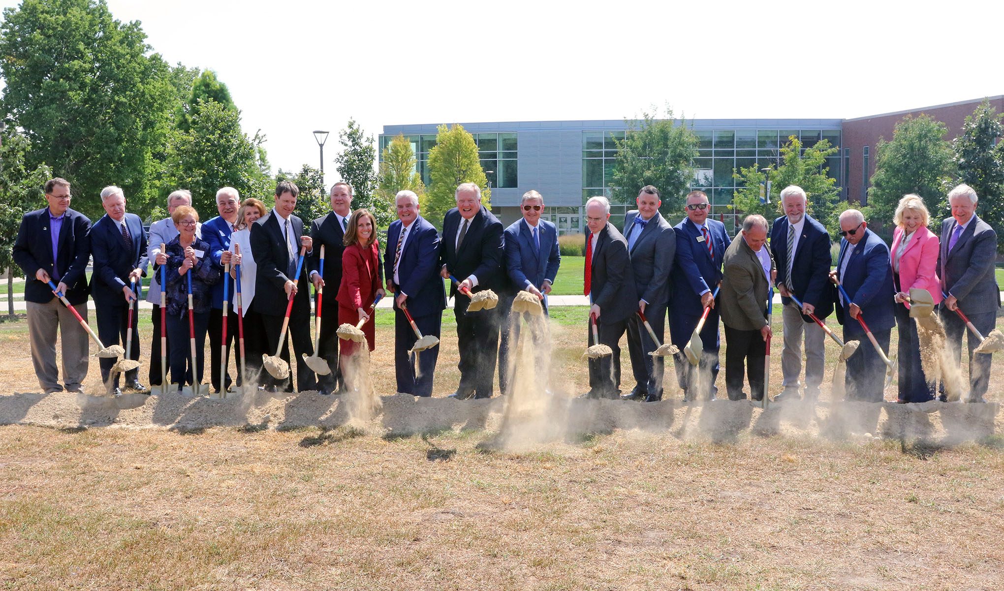 A team of 20 shovelers broke ground Tuesday on the UNK-UNMC Rural Health Education Building&period;