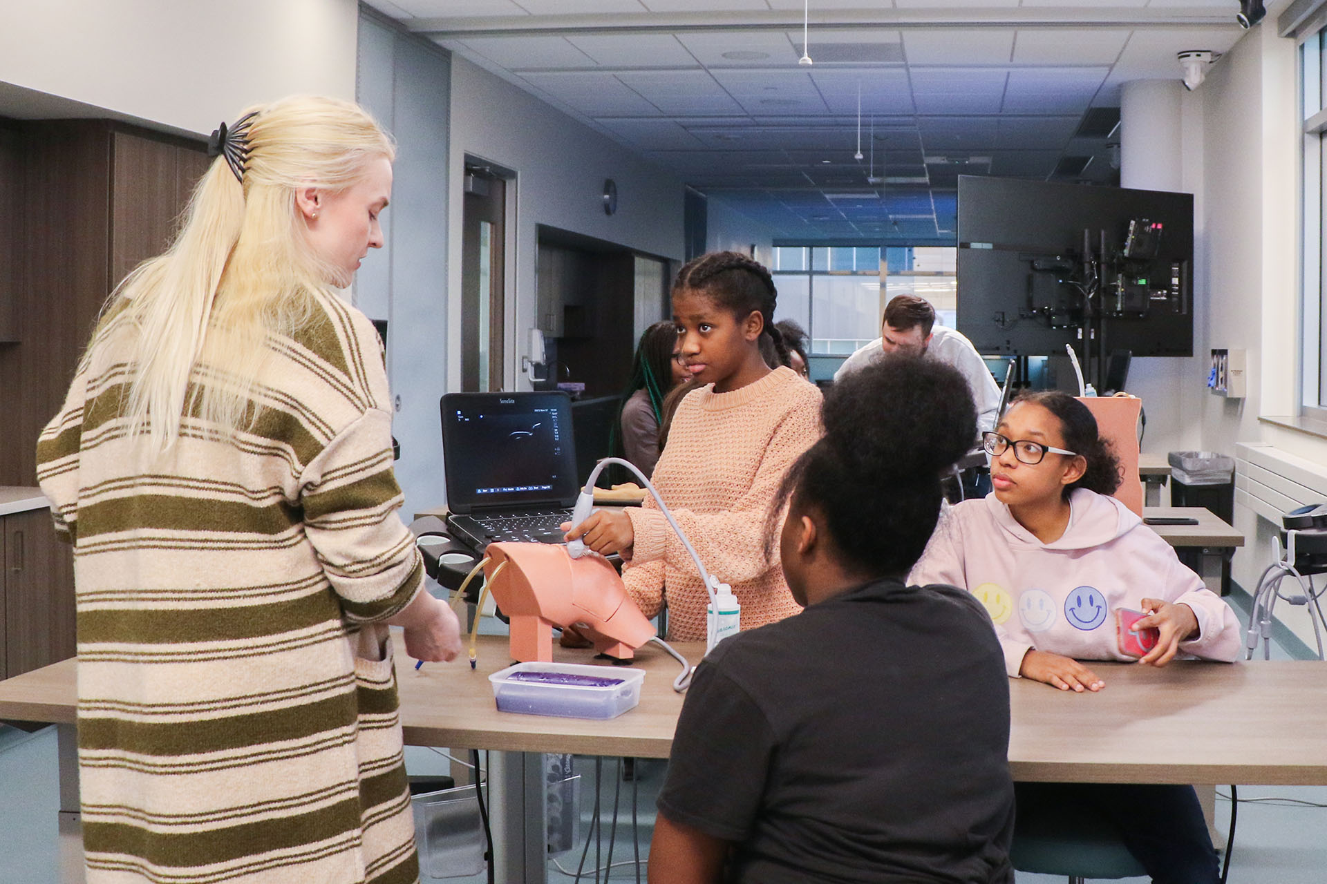 Radiology resident Liz Pruss&comma; MD&comma; left&comma; served as a teacher and role model for visiting teenagers during a recent "Rad Girls" experiential educational event put on by the UNMC College of Medicine&apos;s Radiology Interest Group&comma; UNMC&apos;s iEXCEL program and Girls Inc&period; Omaha&period;