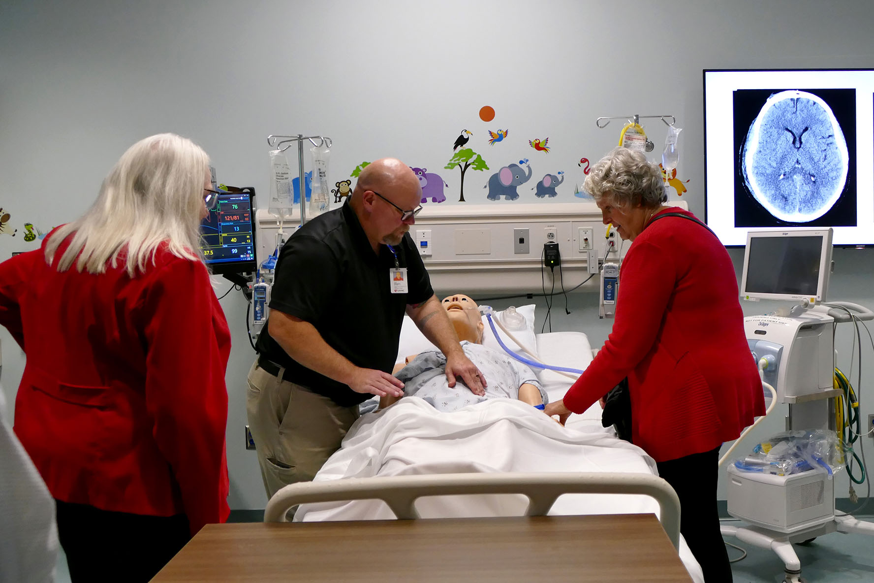 President&apos;s Advisory Council members Dori Bush&comma; at left&comma; and Jane Schuchardt&comma; at right&comma; see a simulation manikin during their tour of iEXCEL and the Davis Global Center&period;