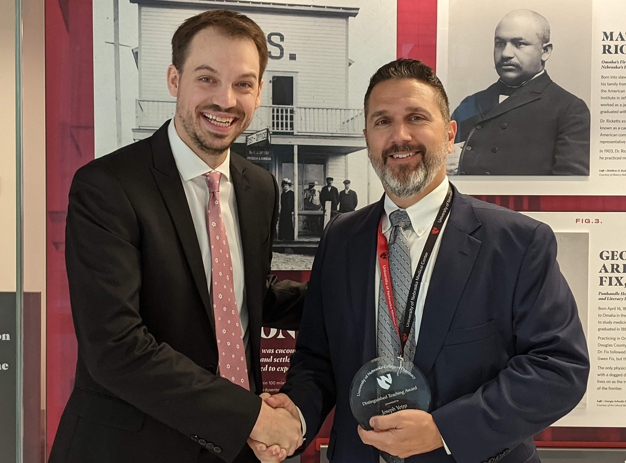 Skyler Maclean&comma; P4 class president for the UNMC College of Pharmacy&comma; and Joseph Vetro&comma; PhD&comma; associate professor of pharmaceutical sciences