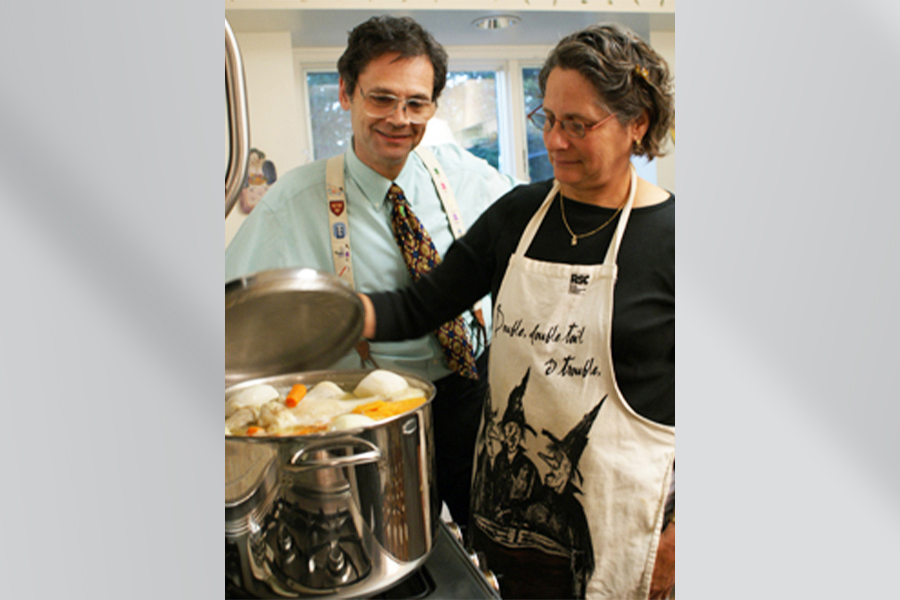 UNMC researcher Stephen Rennard&comma; MD&comma; and co-investigator&comma; wife Barbara Rennard&comma; in the lab&comma; er kitchen&comma; with research subject&comma; aka chicken soup&period; The couple led publication of a study titled&comma; "Chicken Soup Inhibits Neutrophil Chemotaxis In Vitro&period;"