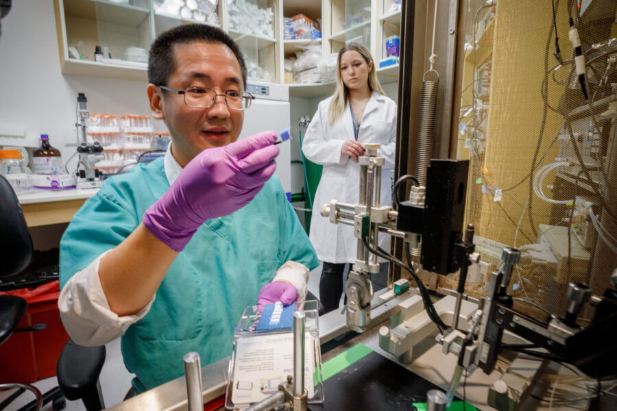Hanjun Wang&comma; MD and staff photographed in his lab in Durham Research Center&period;