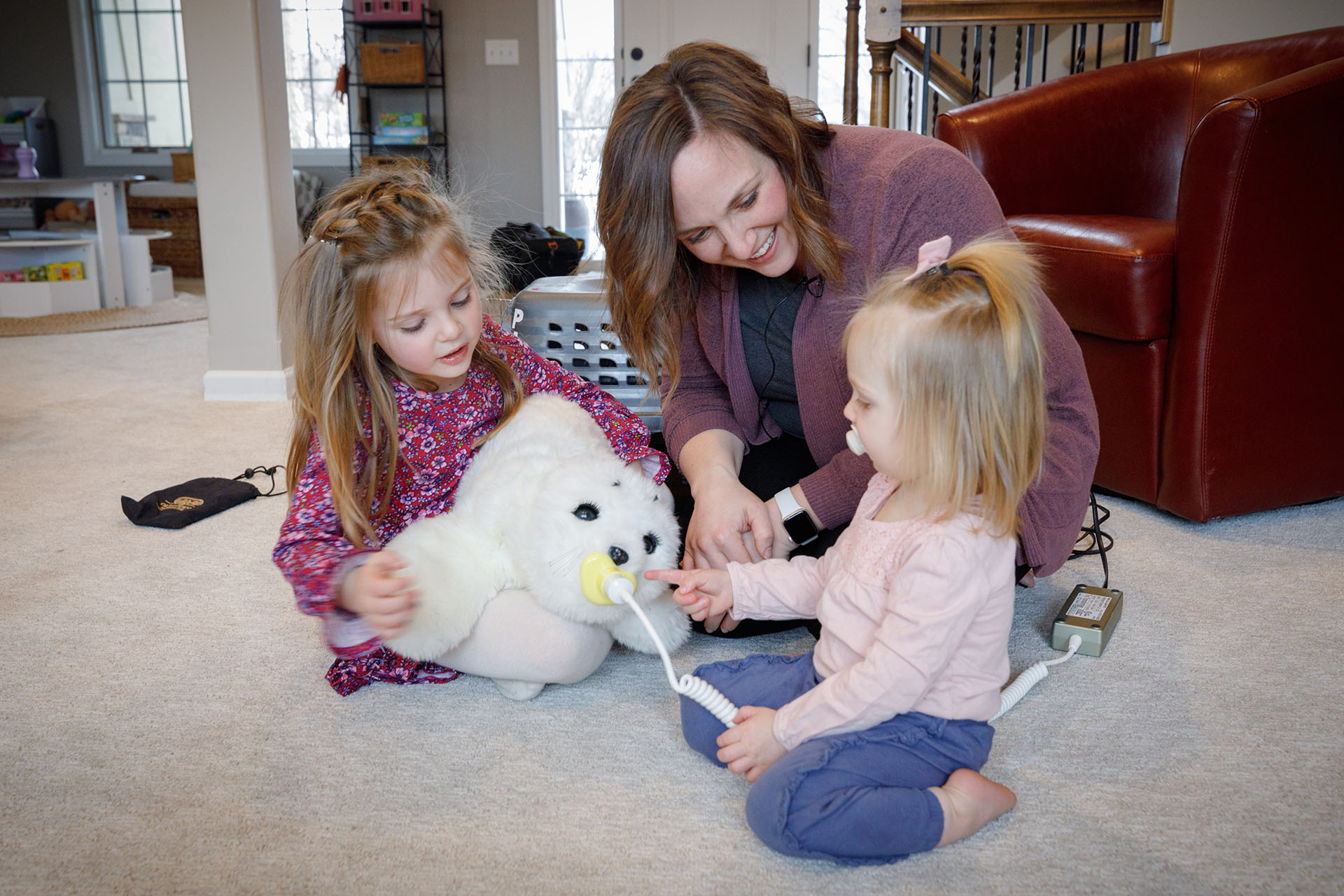 Breanna Hetland&comma; PhD&comma; and her daughters&comma; Layla&comma; 5&comma; and Tully&comma; 19 months&comma; enjoy Paro&comma; the robotic therapy seal in their home&period;