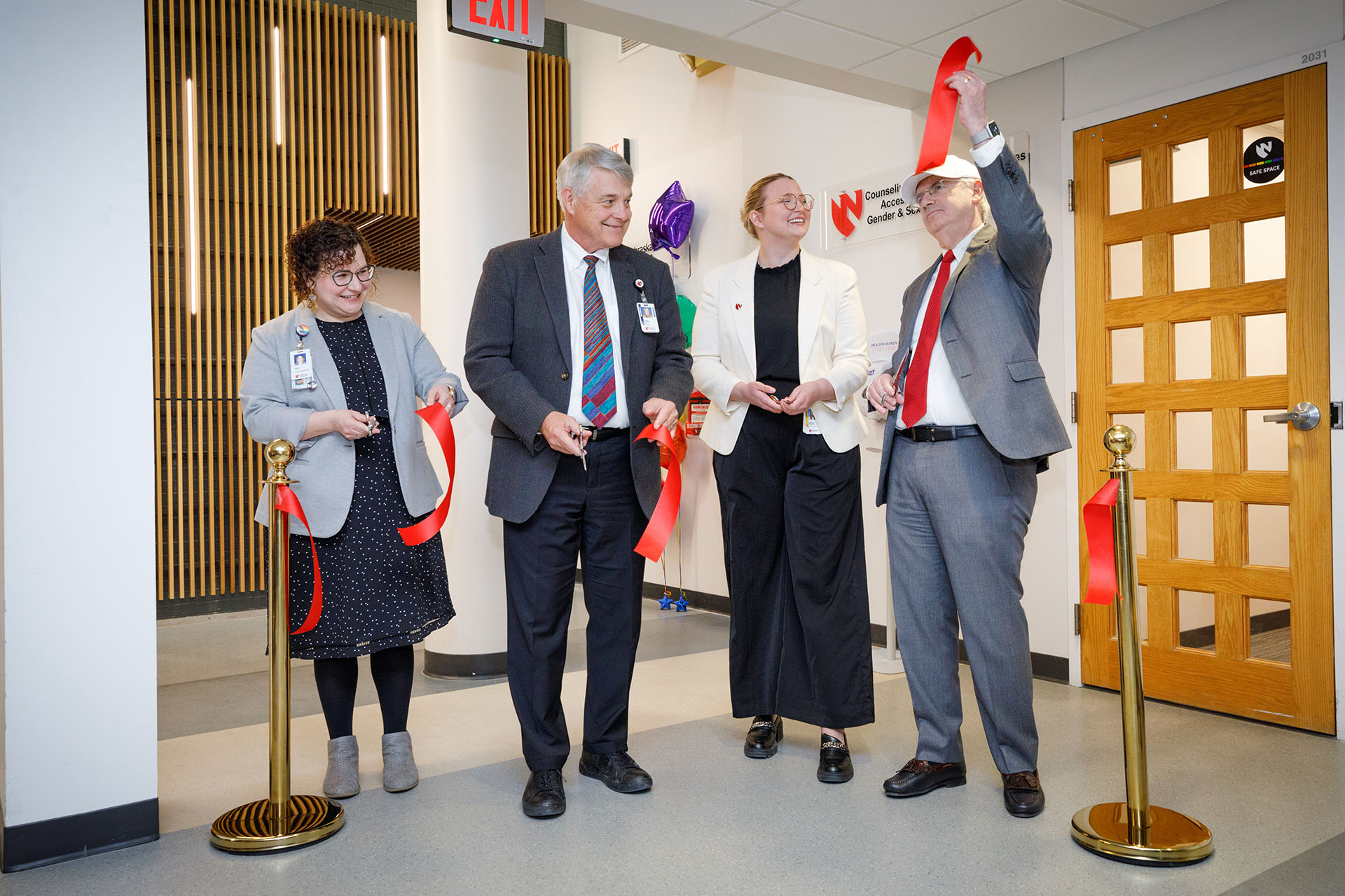 Cutting the ribbon Friday on the new Nebraska Medicine UNMC Student Health Clinic are&comma; from left&colon; Katryn Stratman&comma; clinic manager&semi; Jim Linder&comma; MD&comma; CEO of Nebraska Medicine&comma; Katie Schultis&comma; president of the UNMC Student Senate&comma; and Jeffrey P&period; Gold&comma; MD&comma;  UNMC chancellor&period;