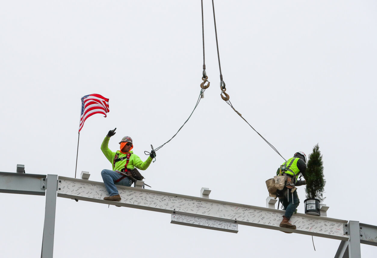 The final structural beam for the new Rural Health Education Building is placed Monday morning during a ceremony at the University of Nebraska at Kearney&period;