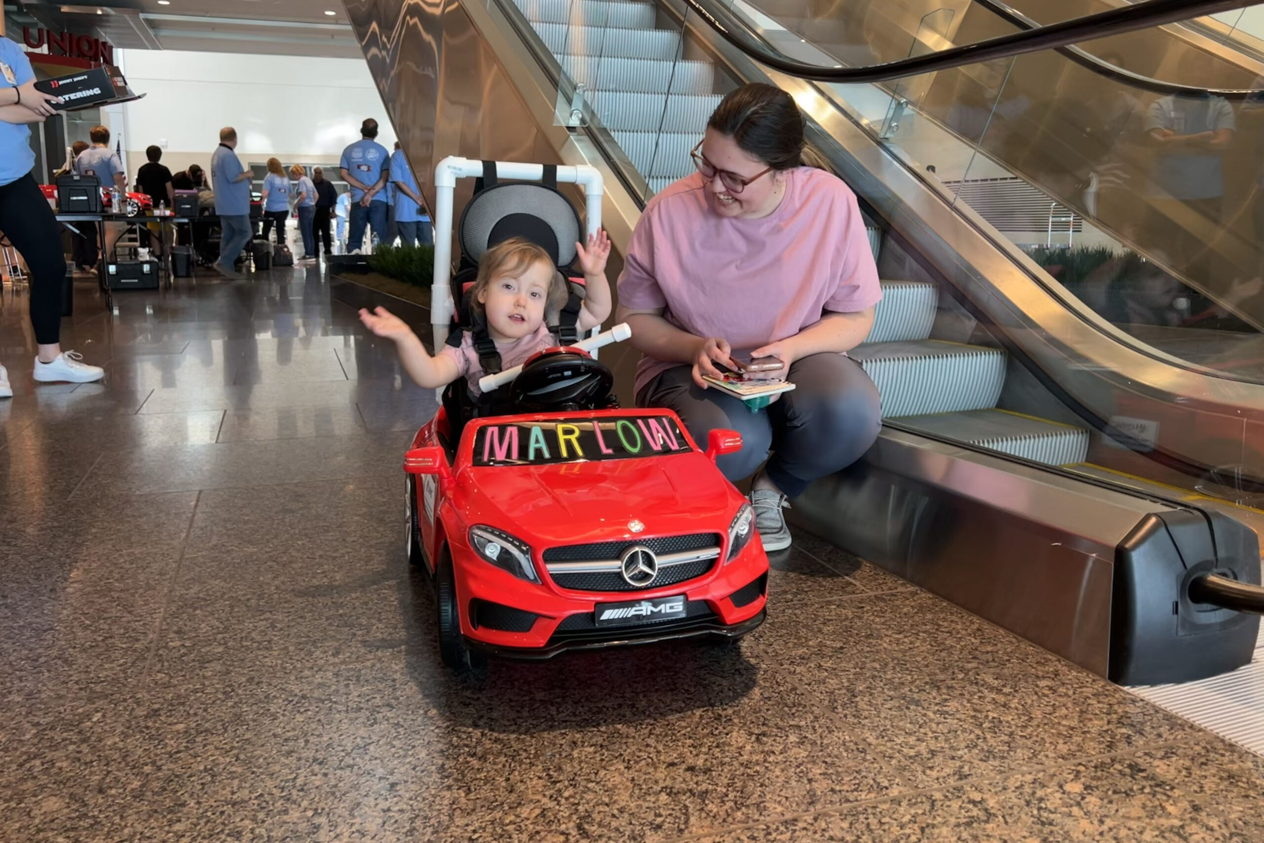 Marlow Bluvas&comma; 2&comma; takes a spin around Union Pacific headquarters in her newly modified toy car&period;