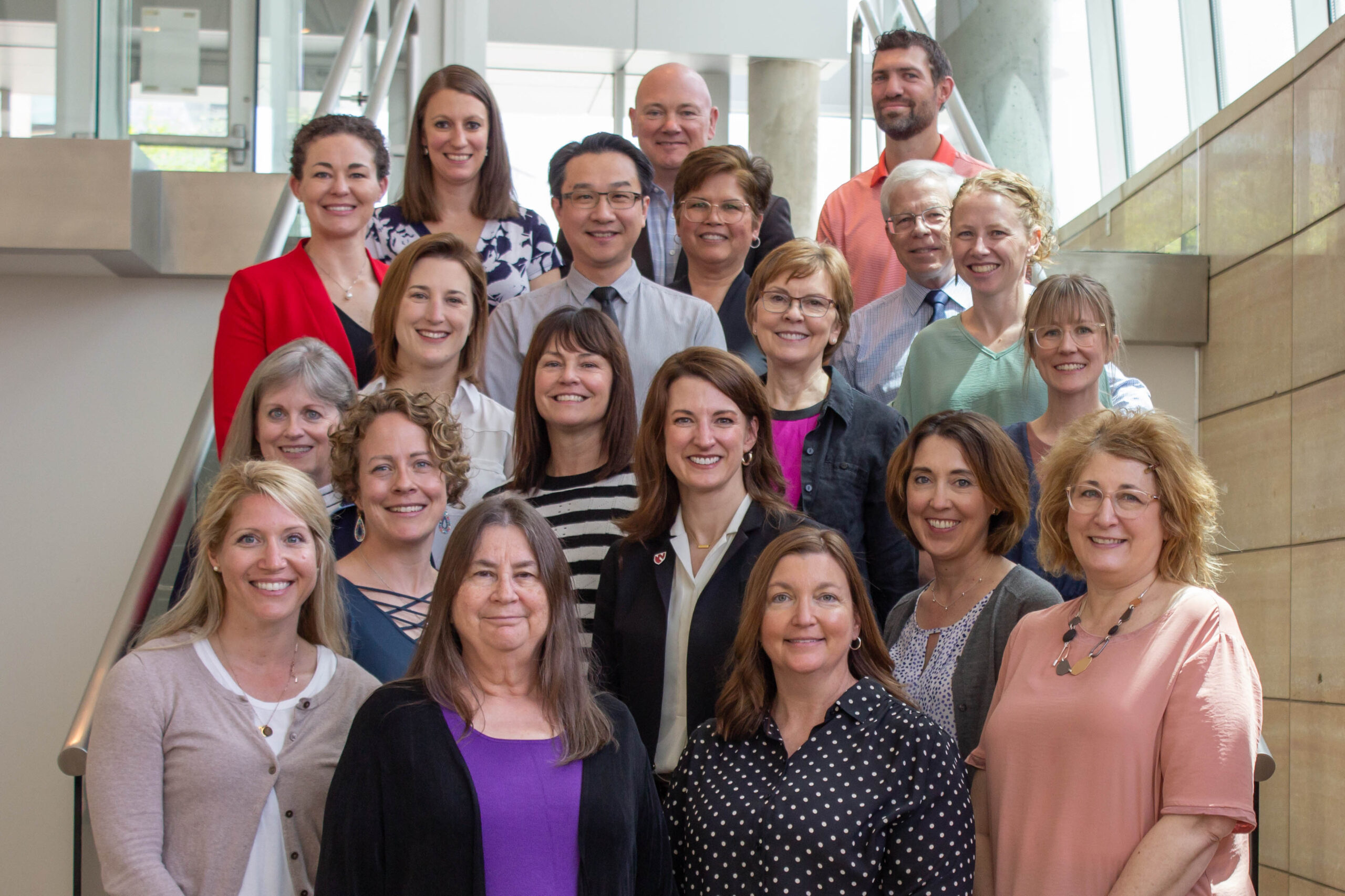 Faculty and staff of the UNMC College of Allied Health Professions&apos; physical therapy program&colon; From left&comma; first row is staff&comma; Marcela Williams&comma; Mary Wood&comma; Megan Krenzer&comma; Michelle Hawkins&period; Faculty are&comma; second row&comma; Tessa Wells&comma; DPT&comma; Betsy Becker&comma; DPT&comma; PhD&comma; Dawn Venema&comma; PhD&semi; third row&comma; Patricia Hageman&comma; PhD&comma; Nikki Sleddens&comma; PhD&semi; fourth row&comma; Sara Bills&comma; DPT&comma; Kathleen Volkman&comma; MS&comma; Kellie Gossman&comma; DPT&semi; fifth row&comma; Megan Frazee&comma; DPT&comma; Ka-Chun &lpar;Joseph&rpar; Siu&comma; PhD&comma; Grace Johnson&comma; DPT&comma; Joseph Norman&comma; PhD &lpar;retired&rpar;&comma; Elizabeth Wellsandt&comma; DPT&comma; PhD&semi; sixth row&comma; Stacie Christensen&comma; DPT&comma; Mike Rosenthal&comma; DSc&comma; Mike Wellsandt&comma; DPT&period; Not pictured&comma; Laura Bilek&comma; PhD&comma; Teresa Cochran&comma; DPT&comma; Kyle Meyer&comma; PhD&comma; Kaitlyn Uwazurike&comma; DPT&period;