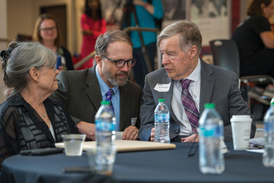 Rick Sacra, MD, left, visits with Phil Smith, MD, who founded and led the Nebraska Biocontainment Unit.