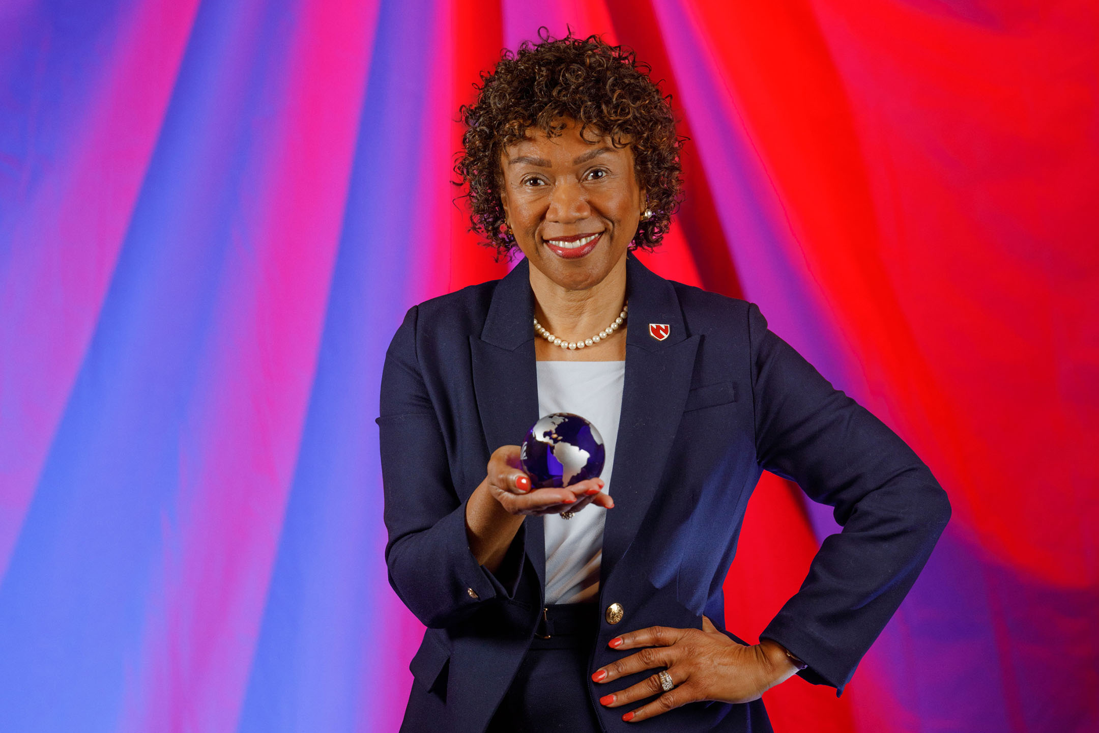 Lepaine Sharp-McHenry, DNP, dean of the UNMC College of Nursing, is holding a paperweight globe, a gift symbolizing the universal impact of nurses worldwide.