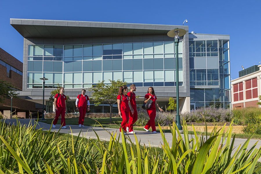 Nursing students walking across campus