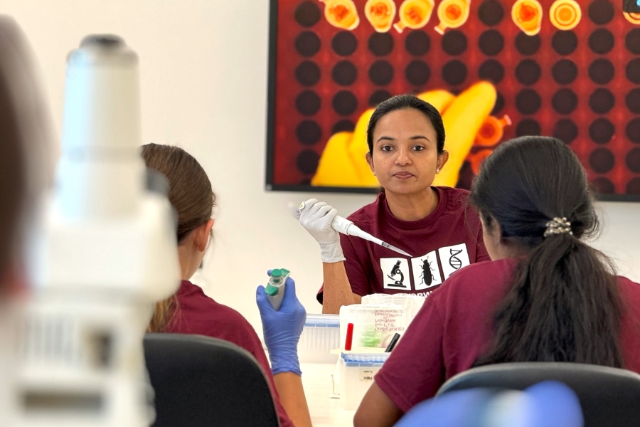 Dr. Sujata Chaudhari, associate professor in UNMC's Department of Pathology, Microbiology and Immunology and director of the workshop, leads students in the laboratory.