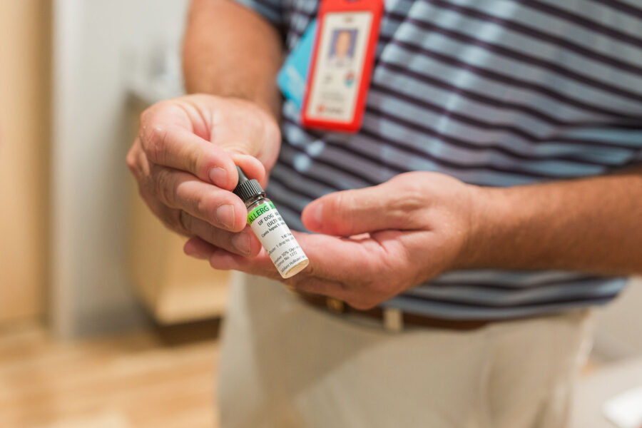 Andrew Rorie&comma; MD&comma; holding a vial