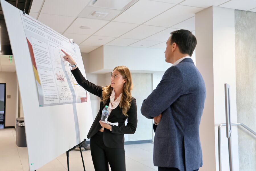 Elizabeth Amato-Hanner with Troy Wildes, MD, during the poster session.