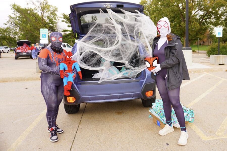 UNMC College of Dentistry students and families&comma; such as these two masked heroes &lpar;dental student Grace Boski and her wife&comma; Kaydence Boski&rpar; turned out to provide treats to children facing accessibility or mobility challenges and their families&period;