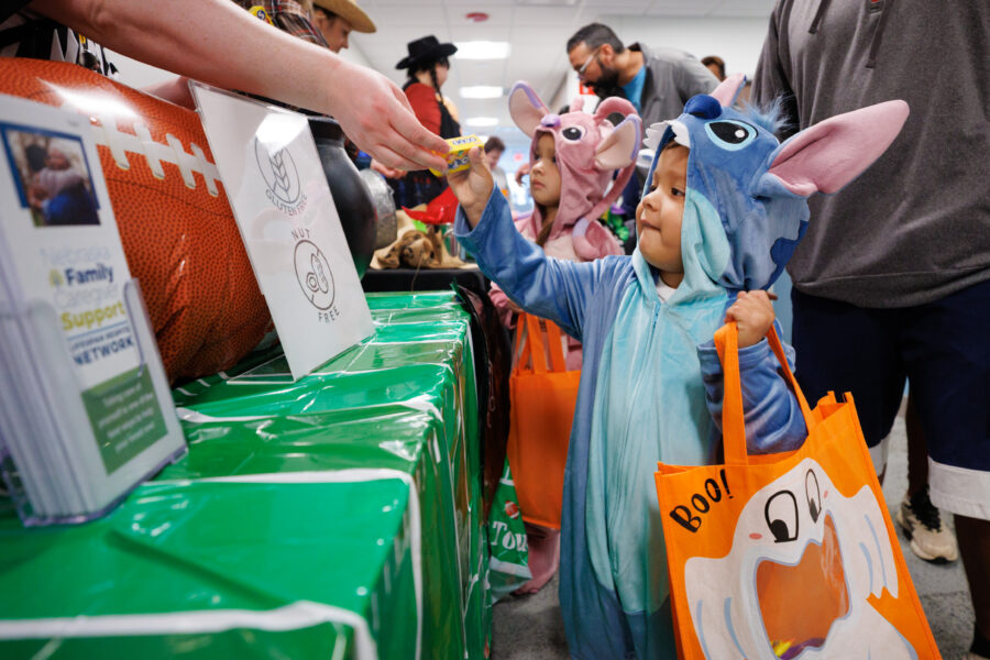 Adrian Mendoza&comma; dressed as Stitch&comma; collects candy during the Munroe-Meyer Institute&apos;s trick-or-treat event&period;