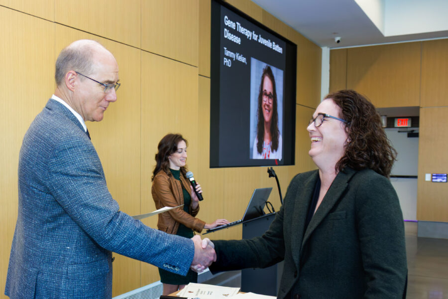 UNMC Vice Chancellor for Research Ken Bayles&comma; PhD&comma; congratulates Tammy Kielian&comma; PhD&comma; at the UNMC College of Medicine Research Retreat in October&period;