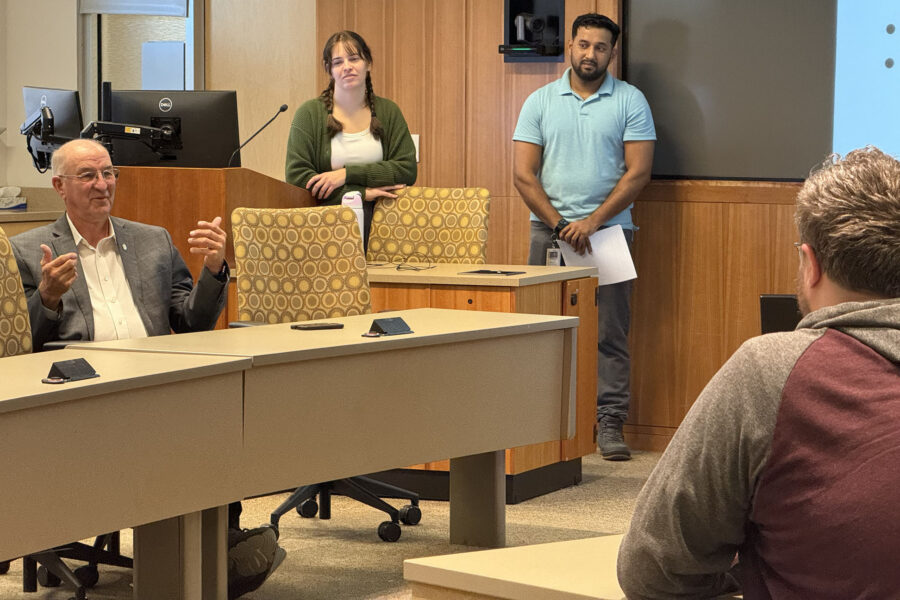 Nebraska State Sen&period; Myron Dorn answers a question during a recent UNMC Student Delegates meeting as Leah Heyen and Del Dsouza&comma; student delegate co-chairs&comma; look on&period;