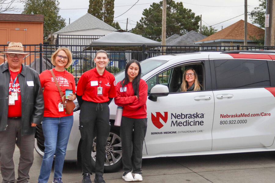 From left&comma; driver Bob Kehn&comma; Melissa Baron of the Fred & Pamela Buffett Cancer Center&comma; UNMC nursing students Rachel Kudirka and Natalie Barrera-Mendoza&comma; and driver Jodi Winchell at the One-Stop Cancer Shop event