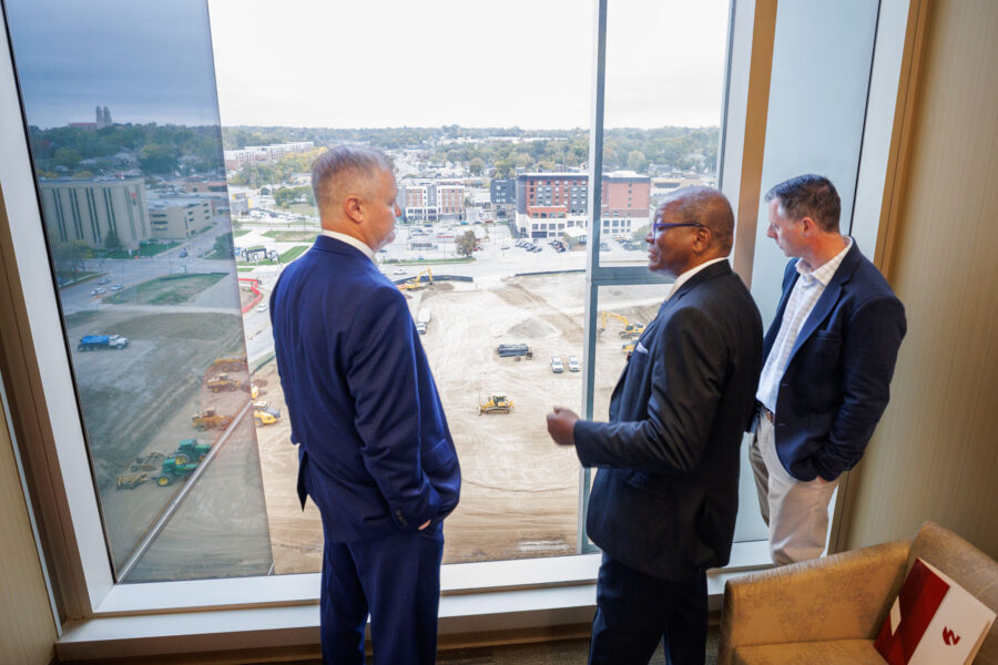 NU Regent Robert Schafer looks at the Project Health construction site from an overlook at the Fred & Pamela Buffett Cancer Center&period; Interim Chancellor H&period; Dele Davies&comma; MD&comma; and Andrew Balus &lpar;at right&rpar;&comma; UNMC’s executive director of utilities and engineering&comma; updated Schafer on the project&period;
