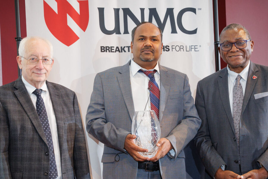 Siddappa Byrareddy&comma; PhD&comma; center&comma; with UNMC College of Medicine Dean Brad Britigan&comma; MD&comma; at left and UNMC Interim Chancellor Dele Davies&comma; MD&comma; at right