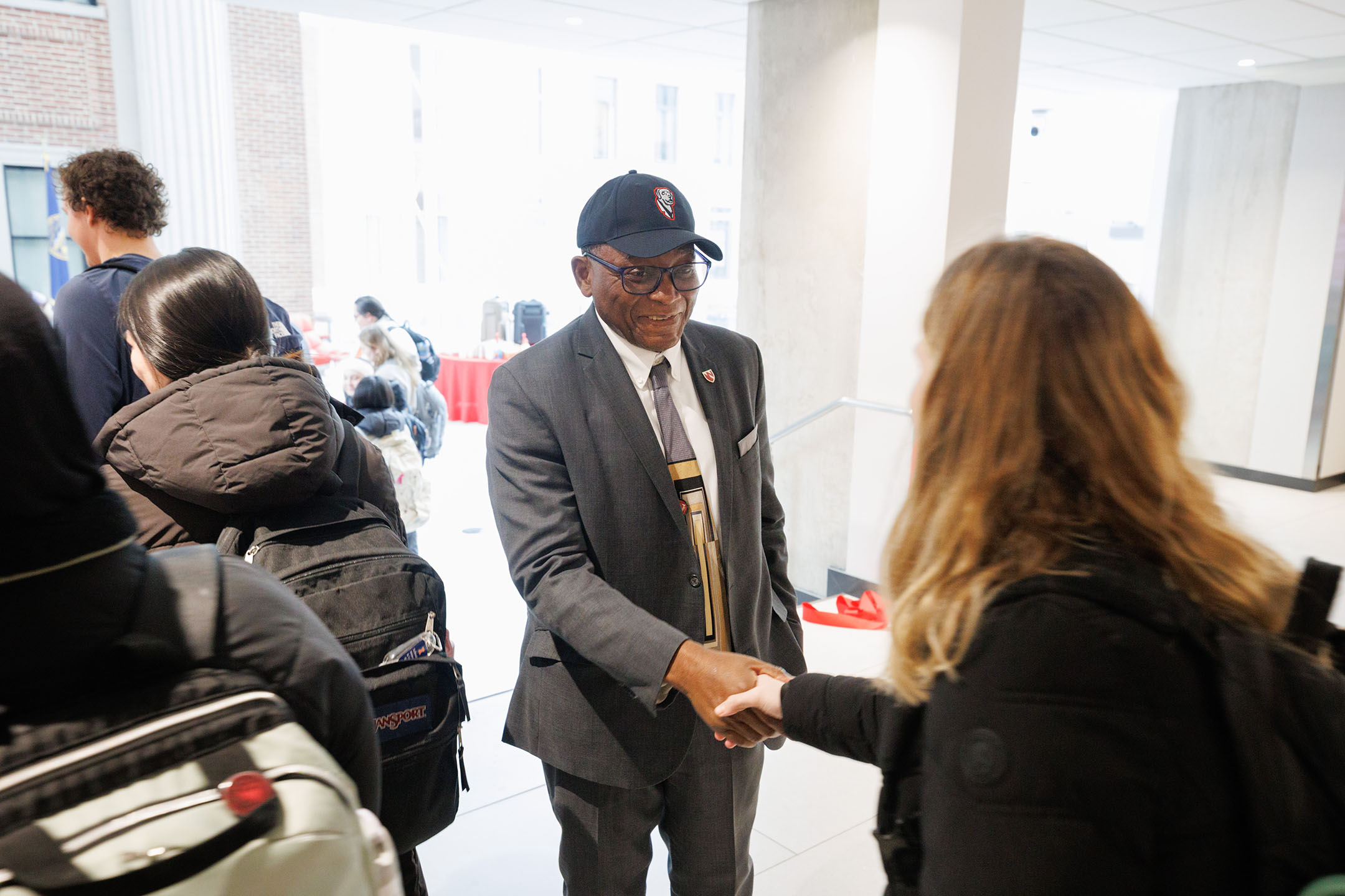 Dr&period; Davies&comma; in his UNMC Labs hat&comma; greeted students and staff visiting the holiday tea&period;