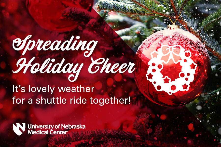 Graphic with a Christmas tree and ornament that says&comma; "Spreading Holiday Cheer"