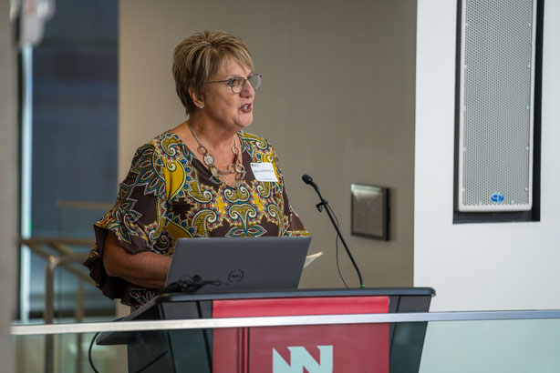 Shelly Schwedhelm speaks in 2024 at the 10th anniversary remembrance of caring for the med center's first patient with the Ebola virus, Richard Sacra, MD. 